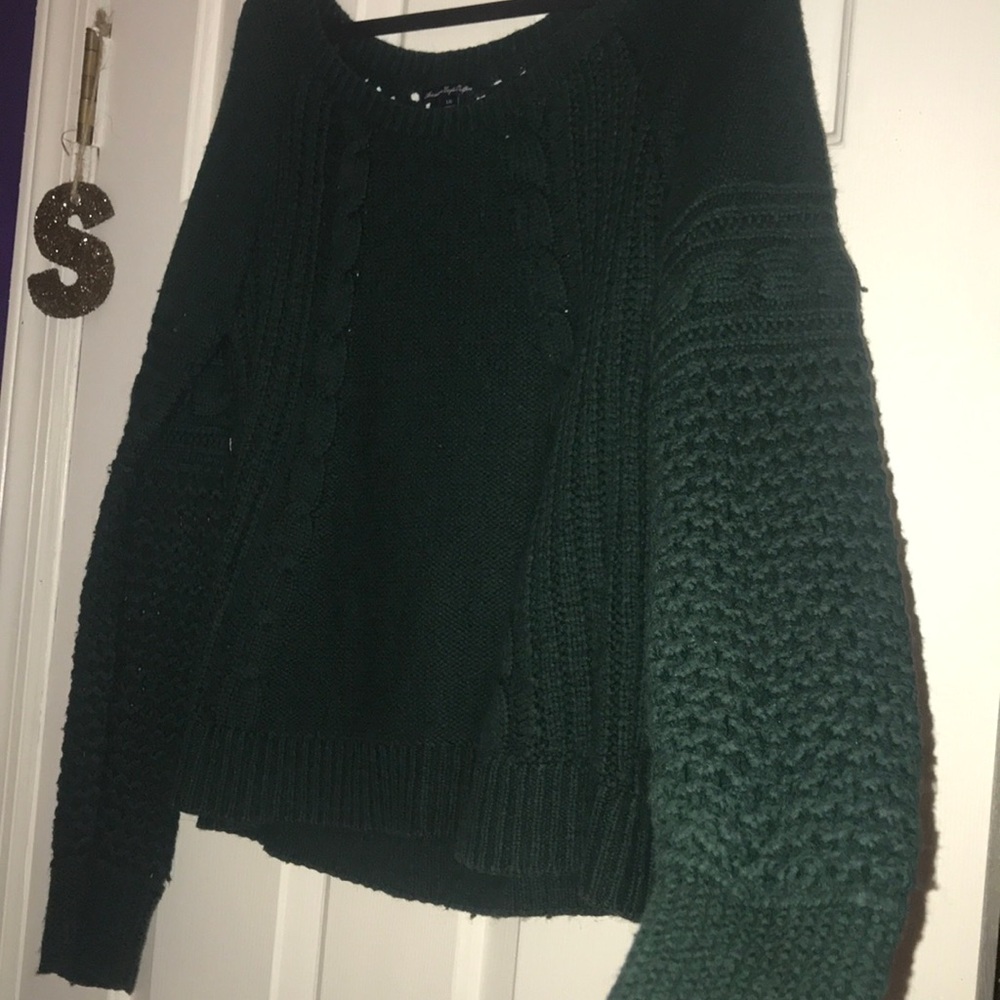 Sweater with hole design in sleeves and back